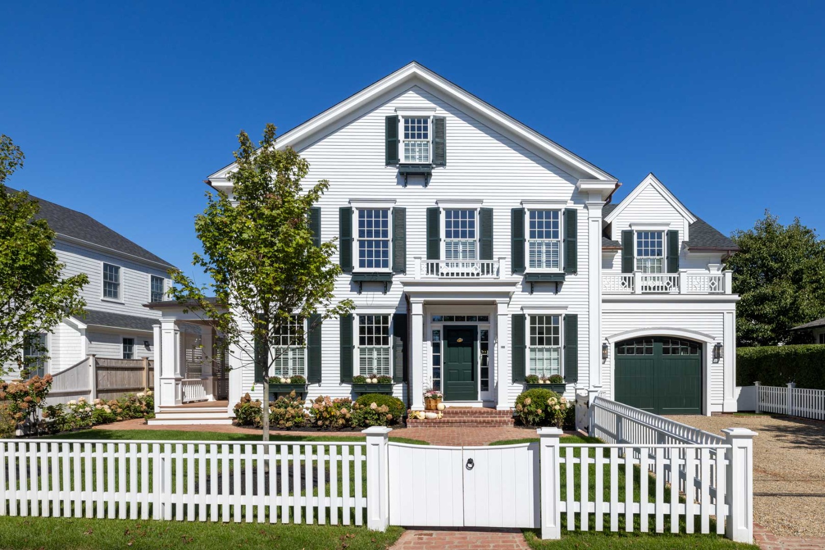183 Upper Main Street Edgartown, MA 02539 - Photo 1 of 33 a front view of a house with a yard