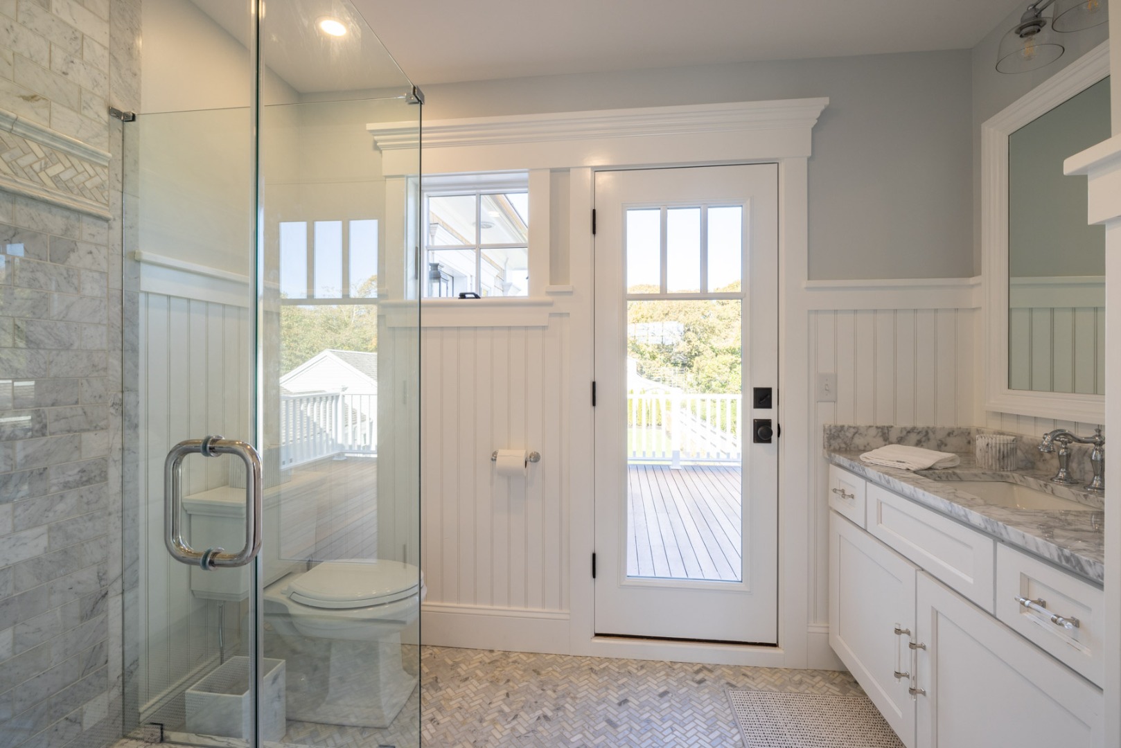 183 Upper Main Street Edgartown, MA 02539 - Photo 19 of 33 a bathroom with a granite countertop sink a toilet and shower