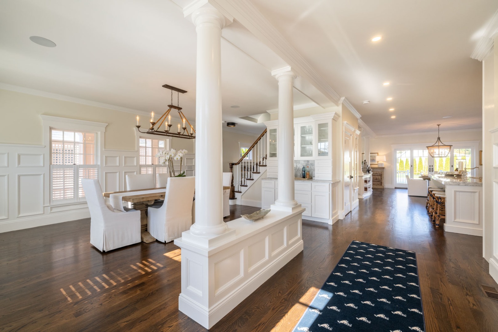 183 Upper Main Street Edgartown, MA 02539 - Photo 8 of 33 a hallway with white cabinets and wooden floor