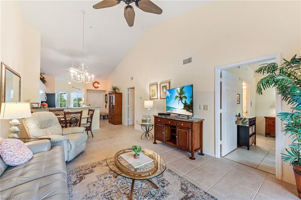 9185 Celeste Drive, Unit 305 Naples, FL 34113 - Photo 11 of 35 a living room with furniture kitchen view and a table