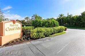 9185 Celeste Drive, Unit 305 Naples, FL 34113 - Photo 23 of 35 a view of a pathway both side of building