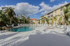 9185 Celeste Drive, Unit 305 Naples, FL 34113 - Photo 29 of 35 a view of outdoor space with trees