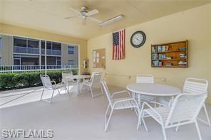 9185 Celeste Drive, Unit 305 Naples, FL 34113 - Photo 33 of 35 a view of a dining room with furniture and a large window