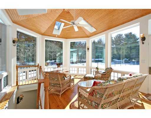 30 Pear Tree Point Road Darien, CT 06820 - Photo 12 of 20 a living room with patio furniture and large windows