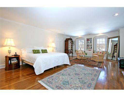 30 Pear Tree Point Road Darien, CT 06820 - Photo 13 of 20 a bedroom with a bed window and table in it