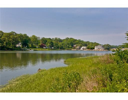 30 Pear Tree Point Road Darien, CT 06820 - Photo 20 of 20 a view of a lake with houses in the back