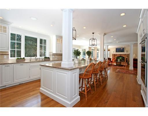 30 Pear Tree Point Road Darien, CT 06820 - Photo 7 of 20 a kitchen with stainless steel appliances kitchen island granite countertop a table and chairs