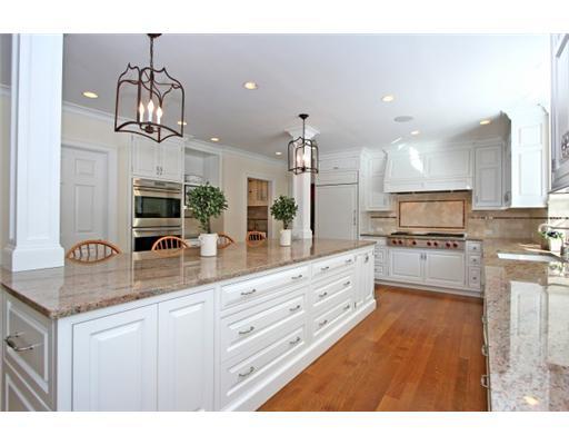 30 Pear Tree Point Road Darien, CT 06820 - Photo 8 of 20 a kitchen with stainless steel appliances granite countertop a sink refrigerator and cabinets
