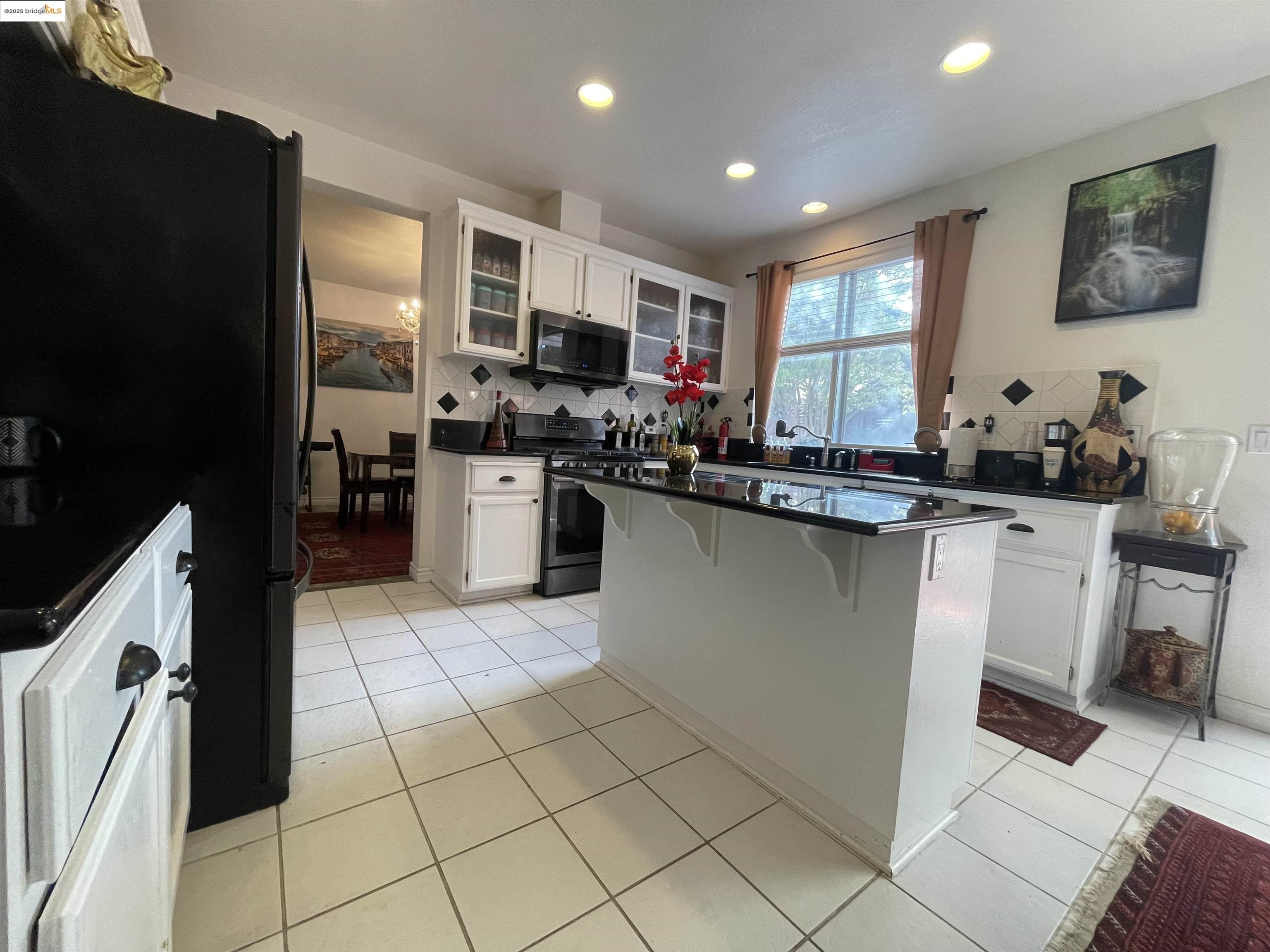 1928 Badger Pass Way Antioch, CA 94531 - Photo 12 of 50 a kitchen with stainless steel appliances granite countertop a refrigerator sink and cabinets