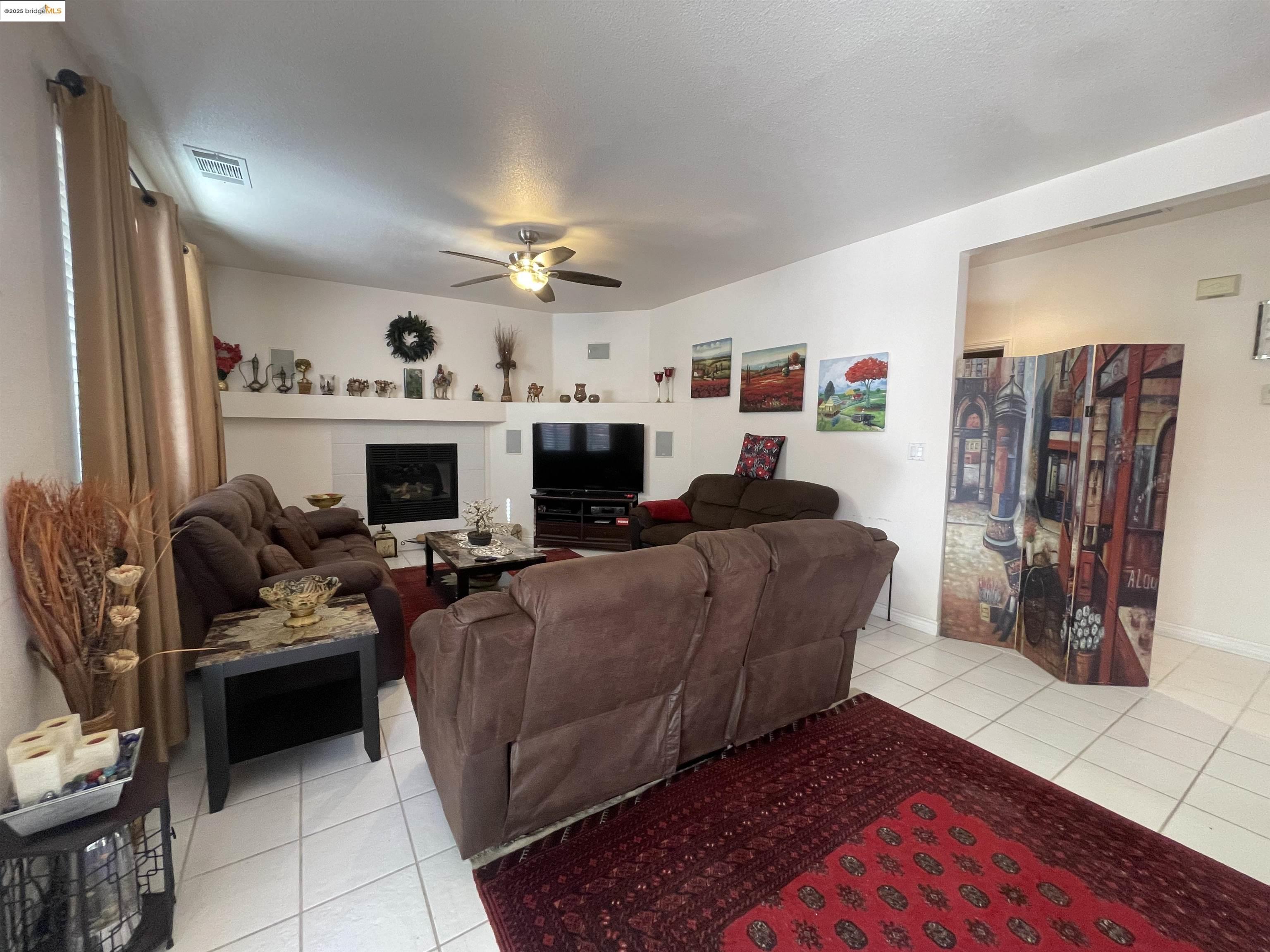 1928 Badger Pass Way Antioch, CA 94531 - Photo 14 of 50 a living room with furniture fireplace and flat screen tv