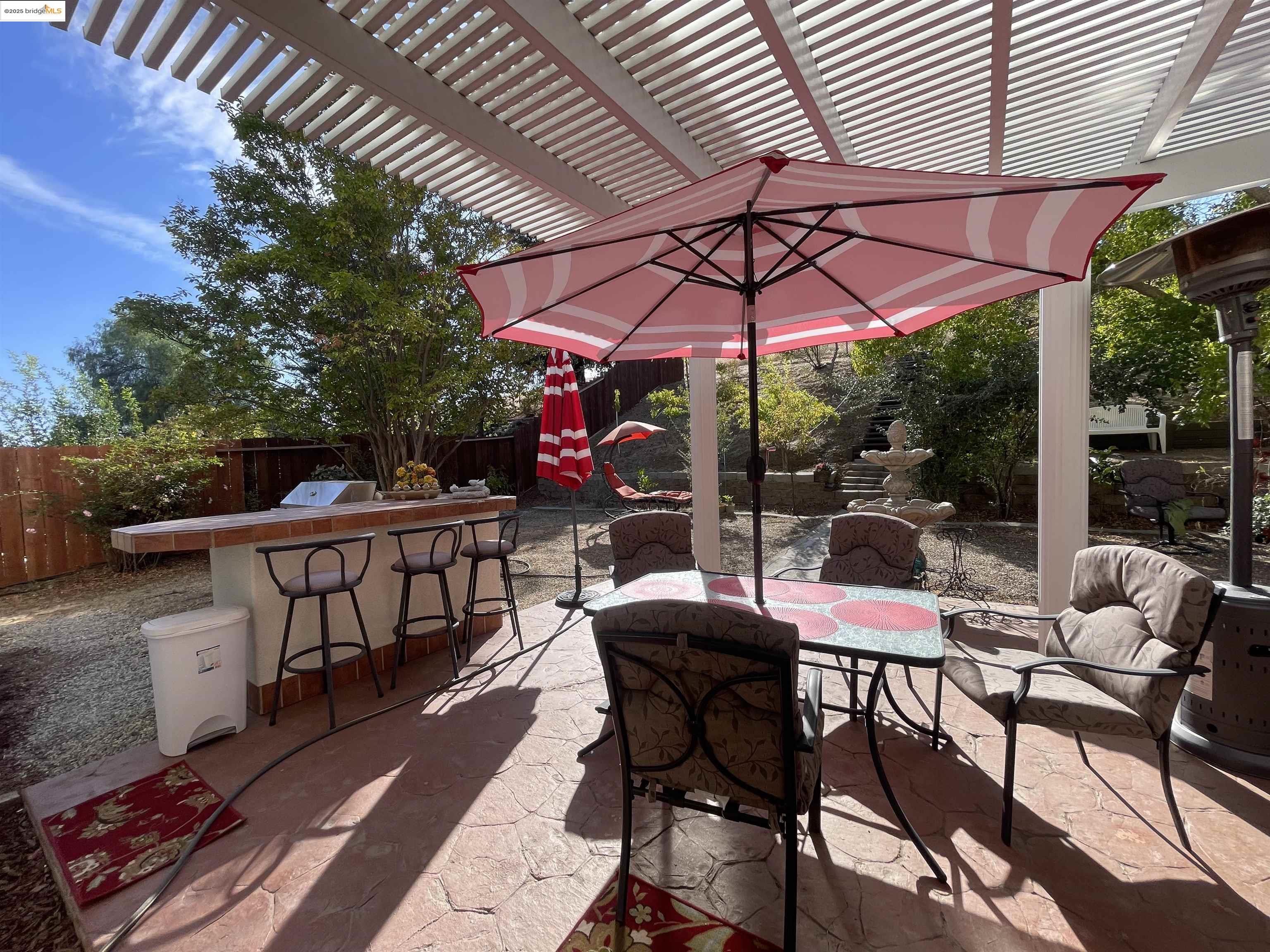 1928 Badger Pass Way Antioch, CA 94531 - Photo 31 of 50 a view of a patio with a table and chairs under an umbrella