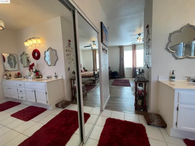 a bed room with a bed closet and a window