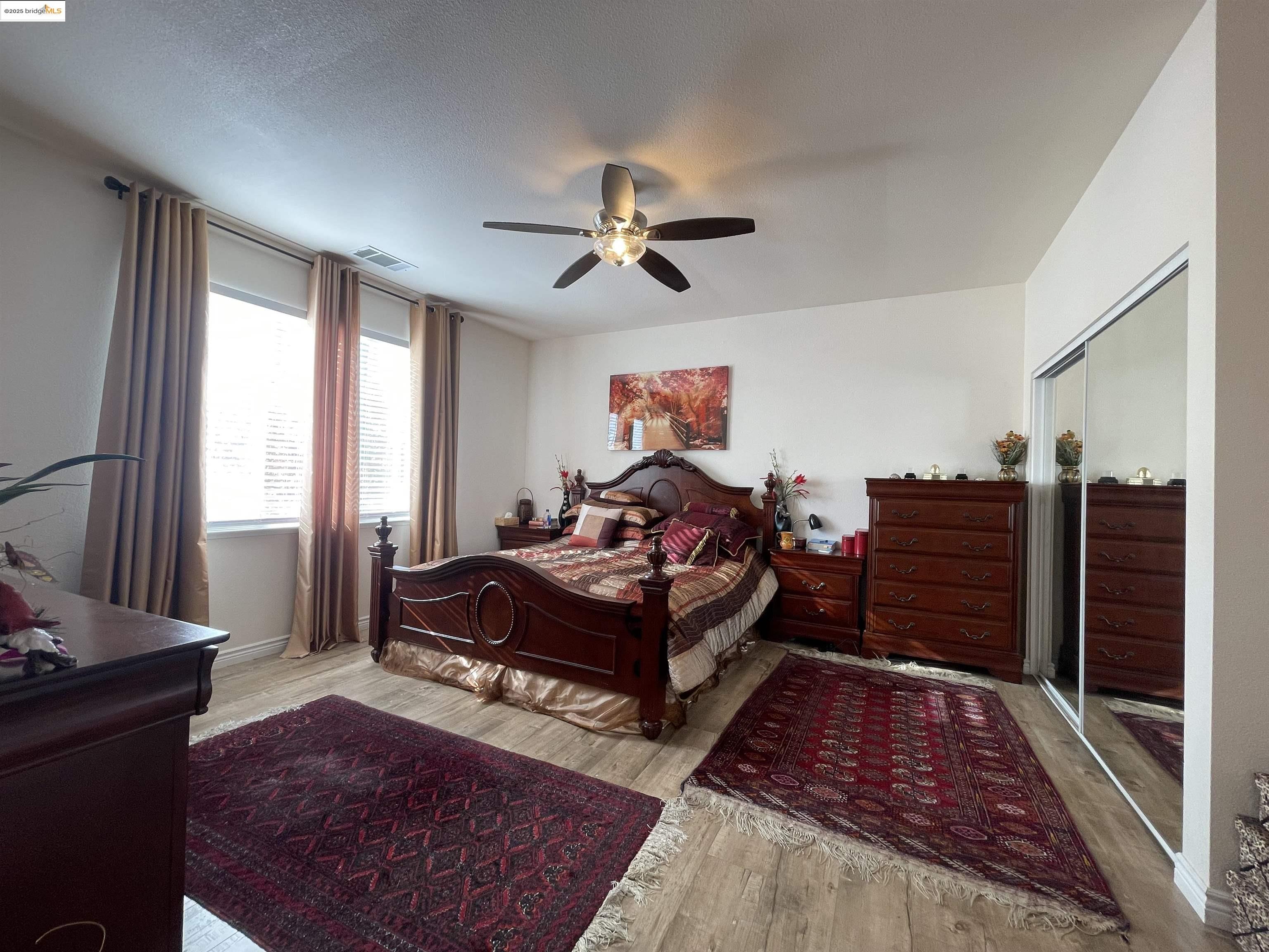 1928 Badger Pass Way Antioch, CA 94531 - Photo 48 of 50 a bed room with a bed and a chandelier