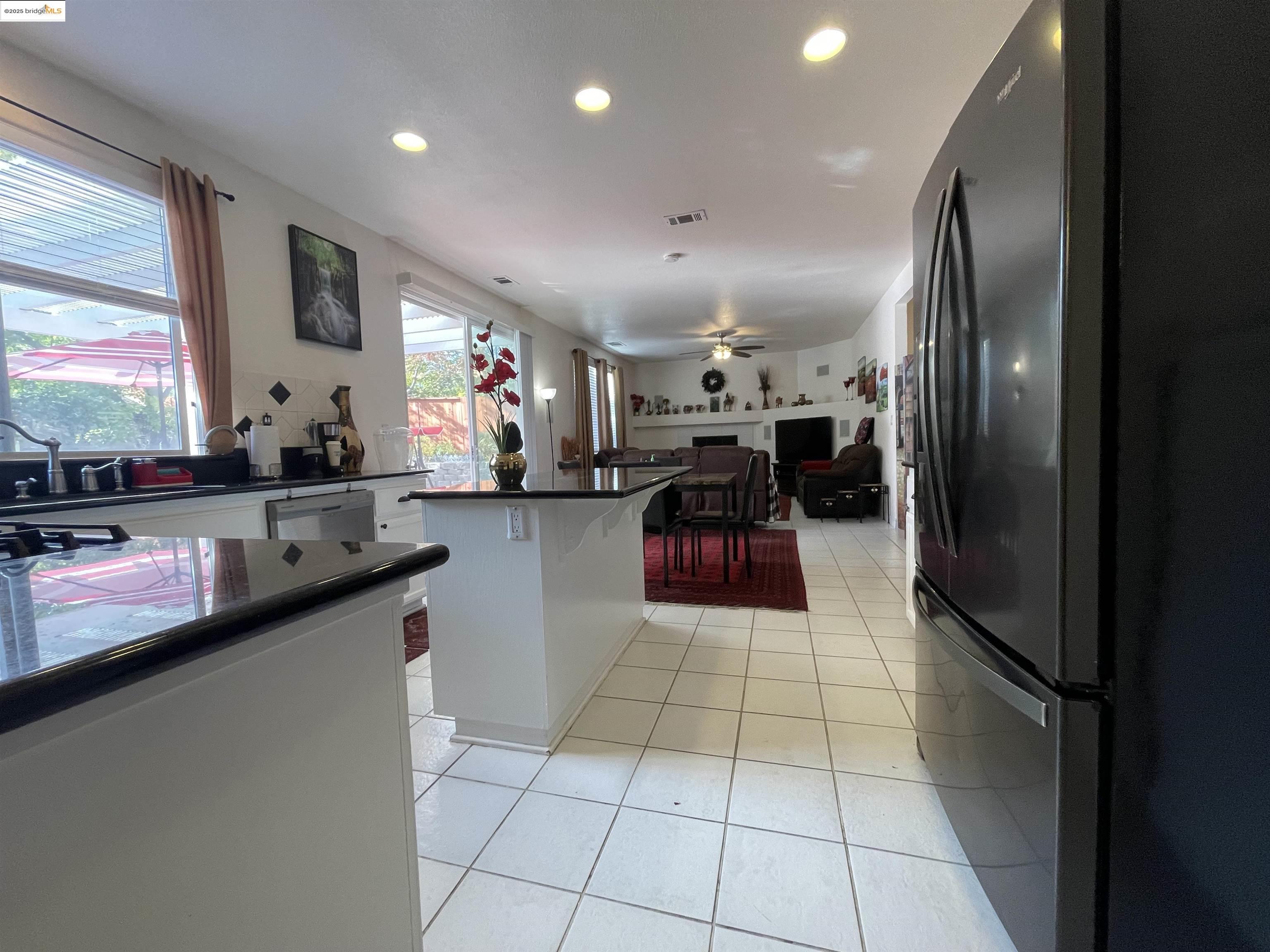 1928 Badger Pass Way Antioch, CA 94531 - Photo 9 of 50 a kitchen with stainless steel appliances granite countertop a refrigerator and a sink