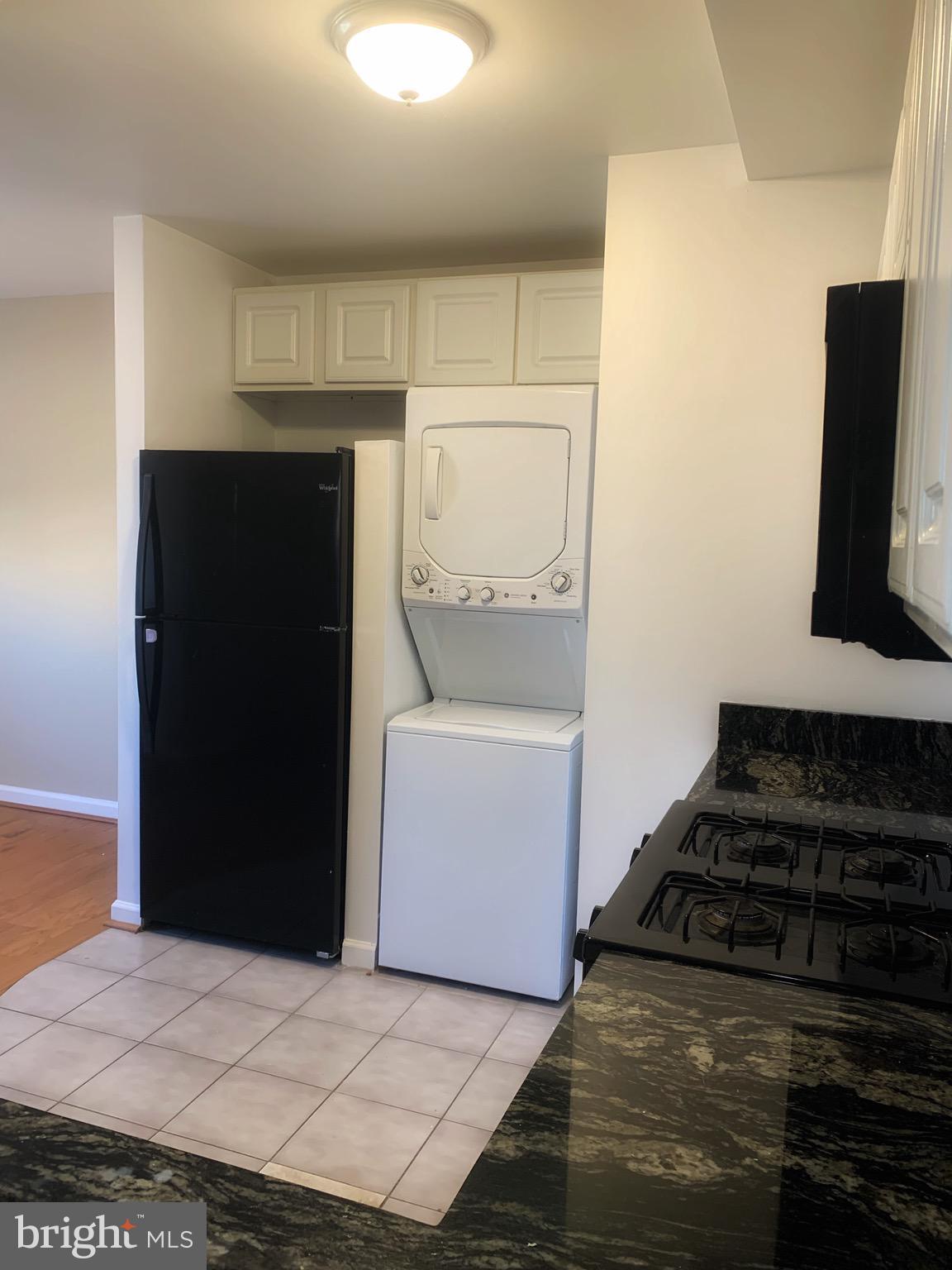 2500 Markham Lane, Unit 1 Landover, MD 20785 - Photo 4 of 4 a kitchen with a stove and a refrigerator