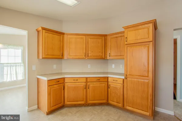 a view of cabinets and wooden floor