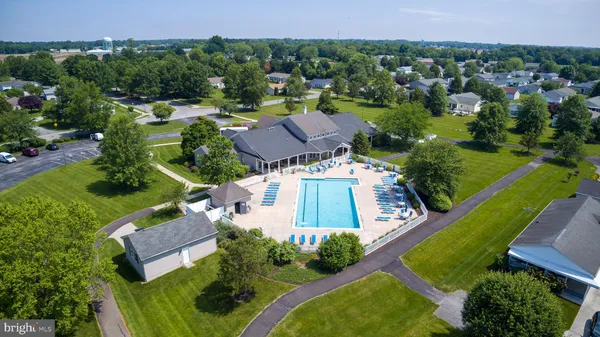 an aerial view of a house with garden space and street view