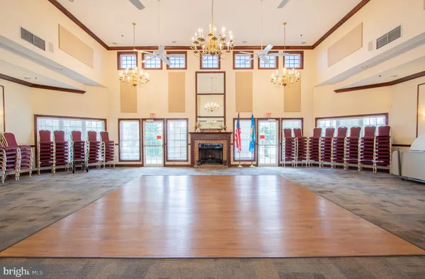 a room with gym equipment and windows