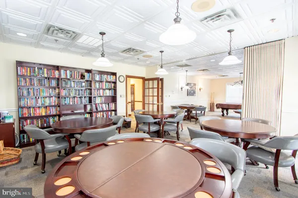 a living room with lots of furniture and a chandelier