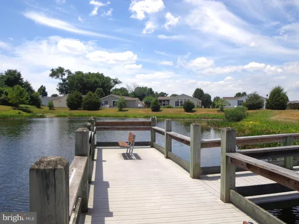 a view of a lake with a yard