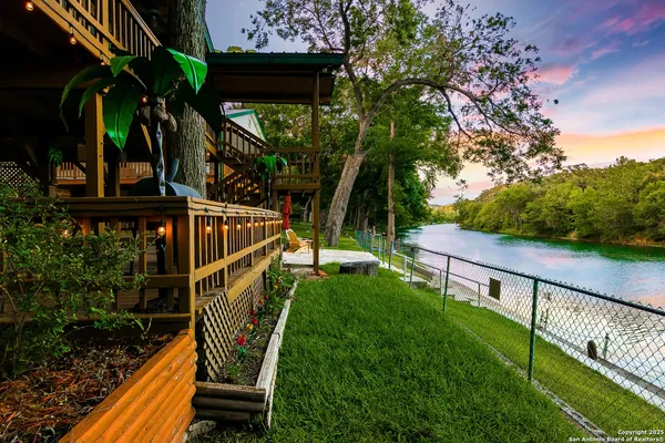 a view of balcony with wooden floor and outdoor seating