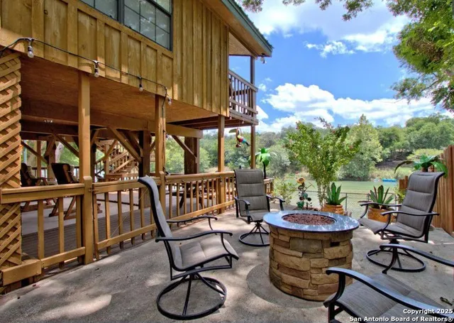 a view of a chairs and table in the balcony