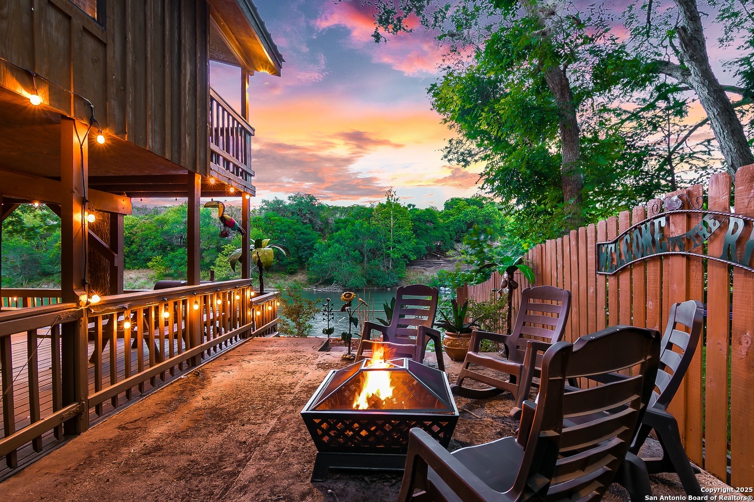 6804 River New Braunfels, TX 78132 - Photo 15 of 16 a view of a patio with a table chairs and a fire pit
