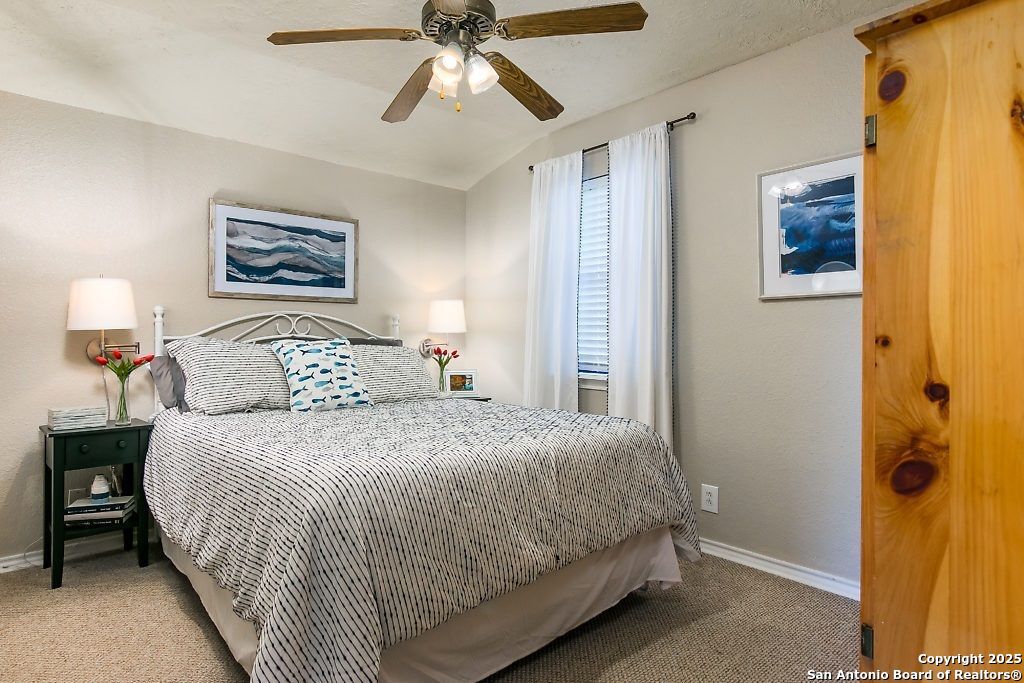 6804 River New Braunfels, TX 78132 - Photo 7 of 16 a bedroom with a bed and a painting on the wall