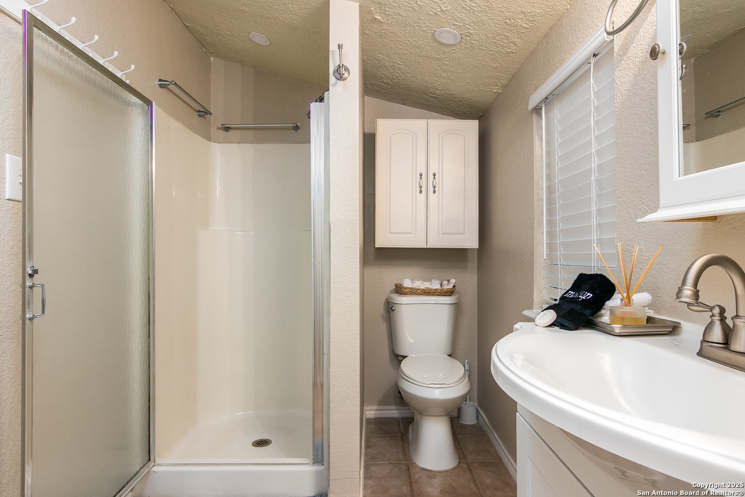 6804 River New Braunfels, TX 78132 - Photo 10 of 16 a white toilet sitting next to a bathroom sink