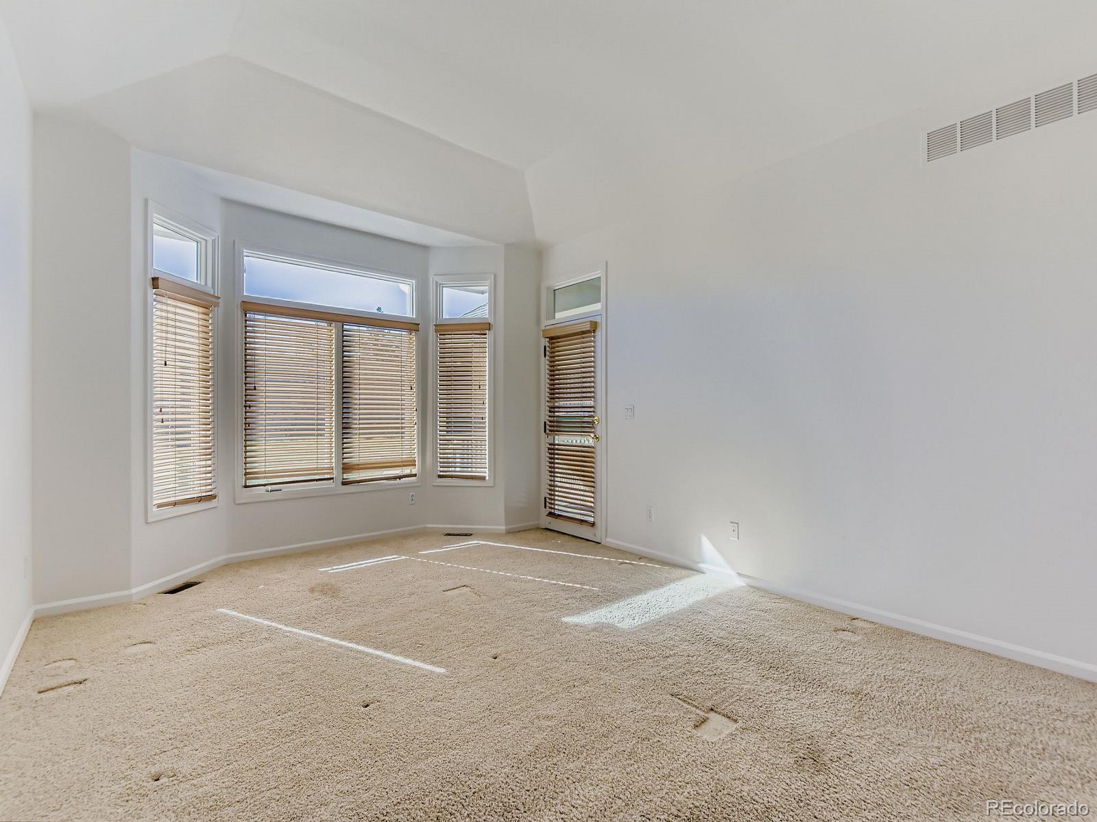 5418 Shetland Court Highlands Ranch, CO 80130 - Photo 11 of 23 an empty room with windows