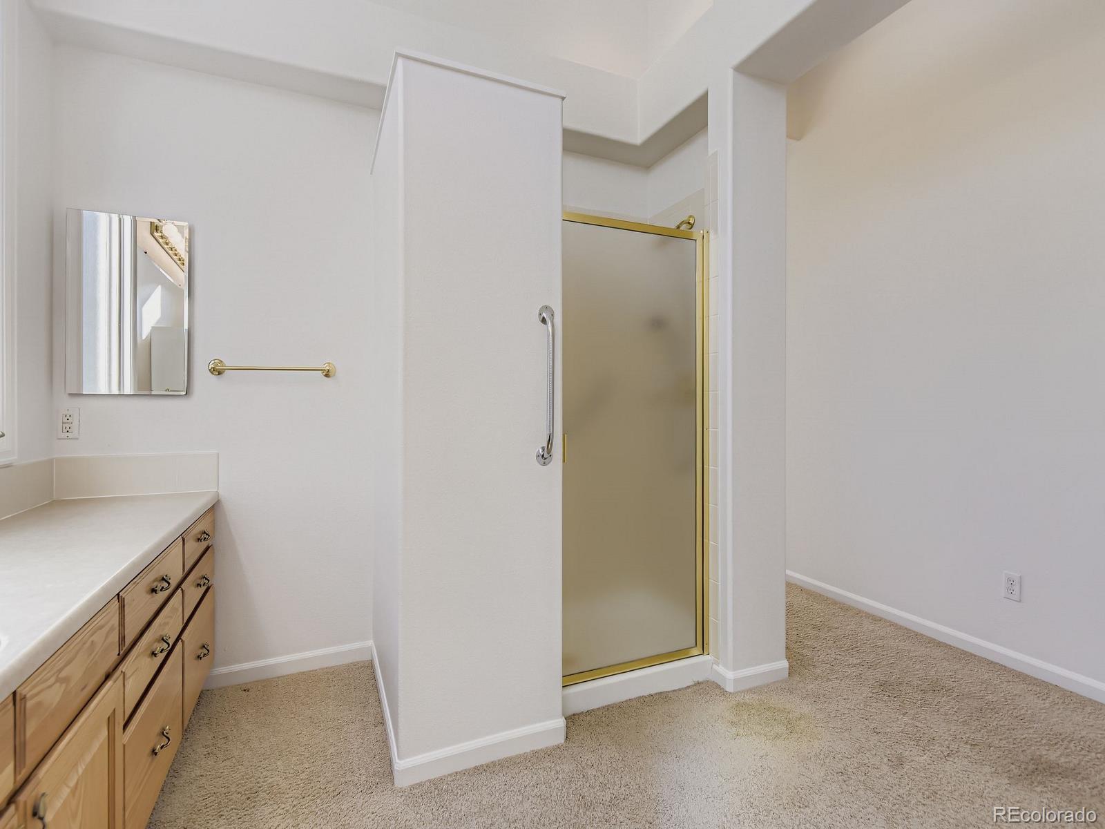 5418 Shetland Court Highlands Ranch, CO 80130 - Photo 12 of 23 a view of cabinets and utility room