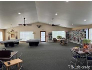 5418 Shetland Court Highlands Ranch, CO 80130 - Photo 20 of 23 a living room with furniture and a fireplace