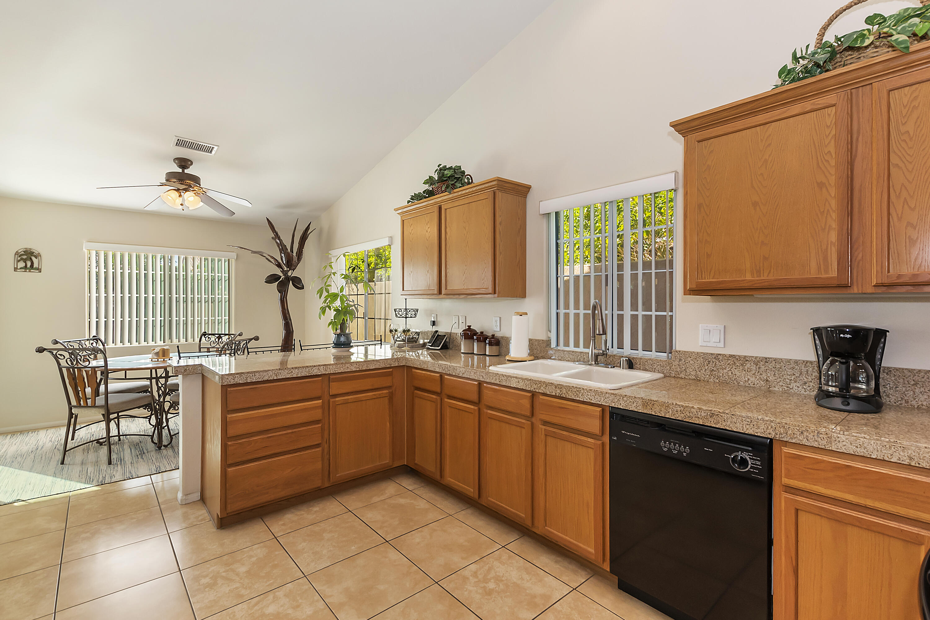 68945 Minerva Road Cathedral City, CA 92234 - Photo 18 of 42 a kitchen with a sink and cabinets