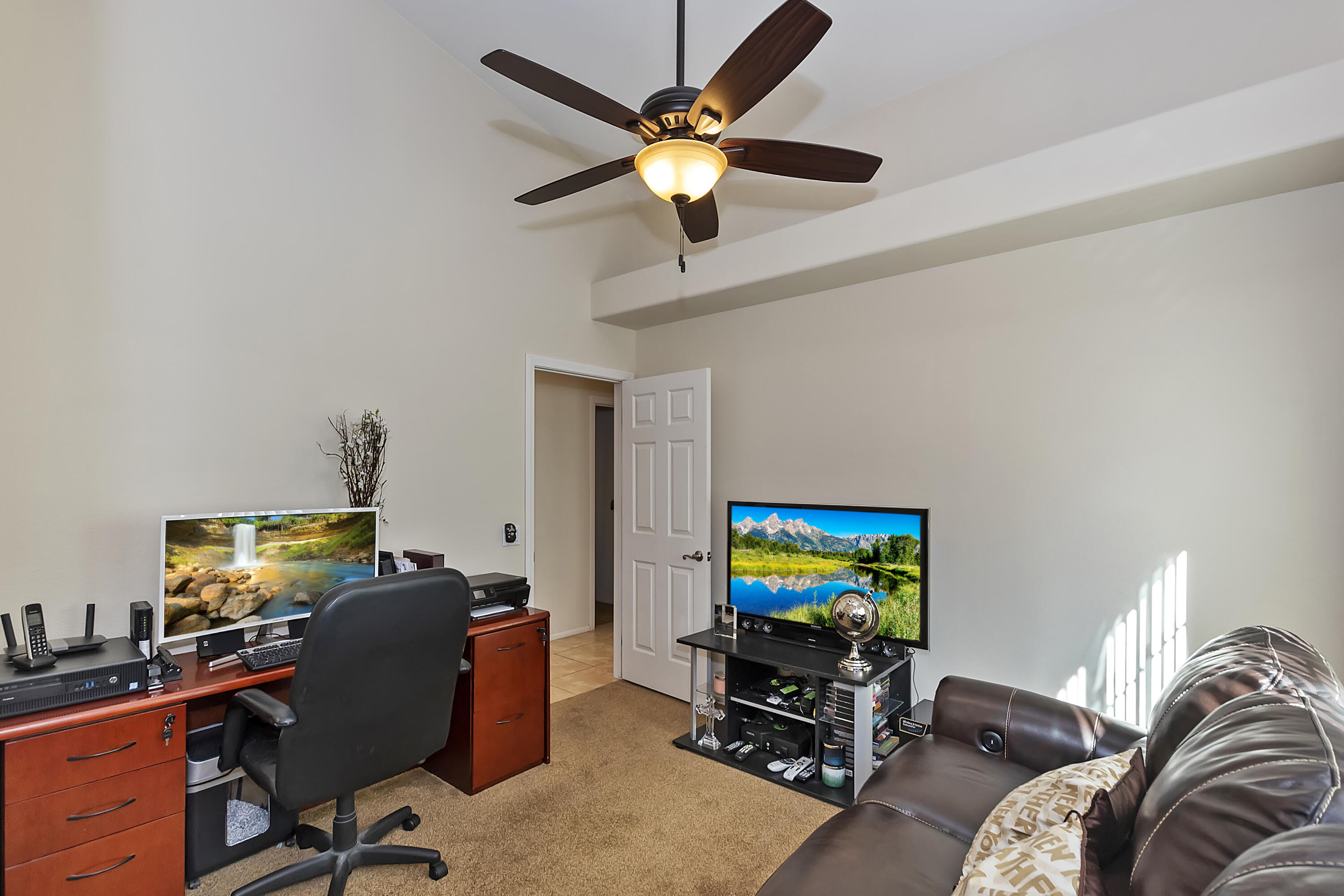 68945 Minerva Road Cathedral City, CA 92234 - Photo 26 of 42 a work room with furniture and a flat screen tv