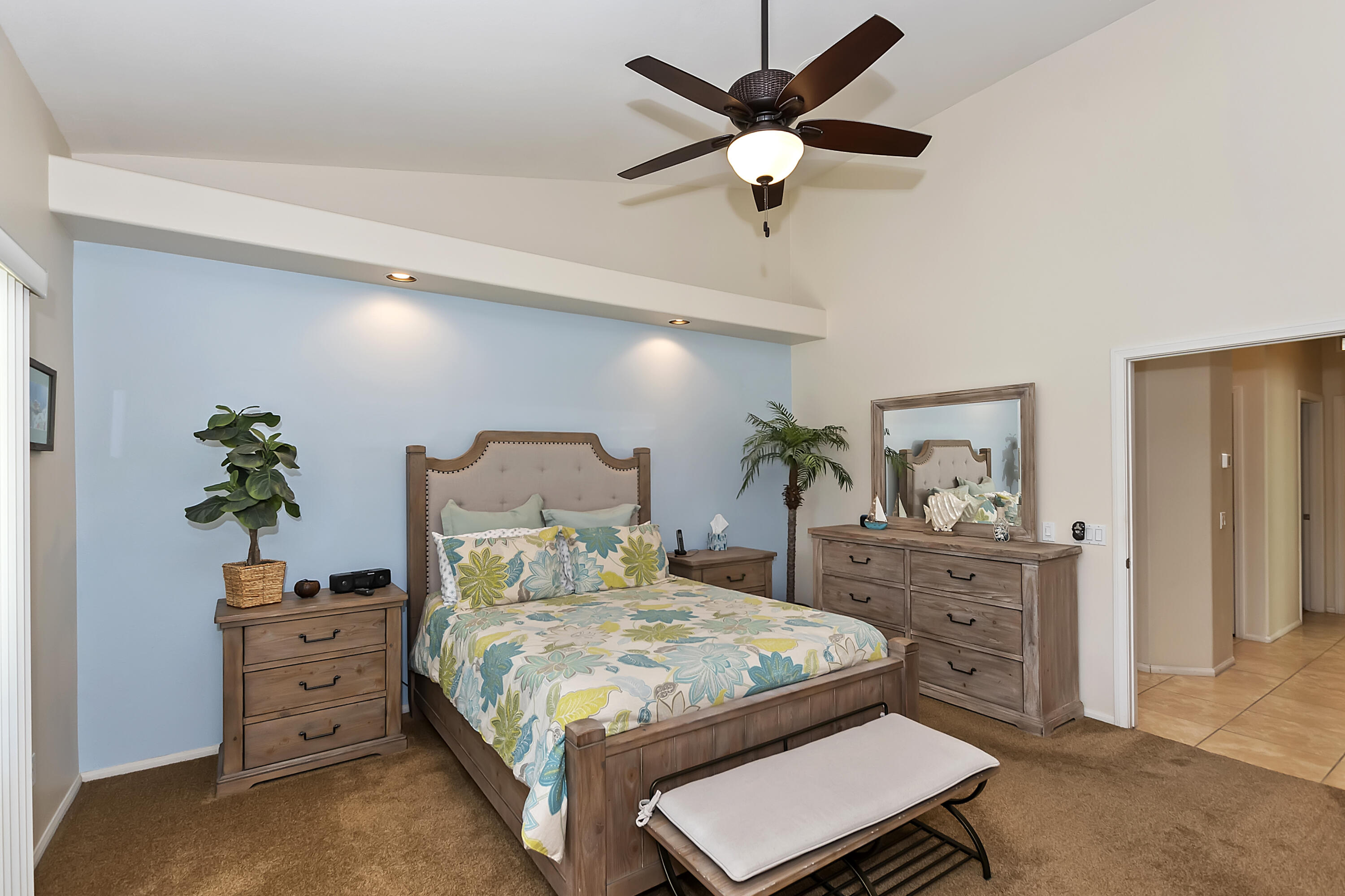 68945 Minerva Road Cathedral City, CA 92234 - Photo 28 of 42 a bedroom with a bed and a dresser in it
