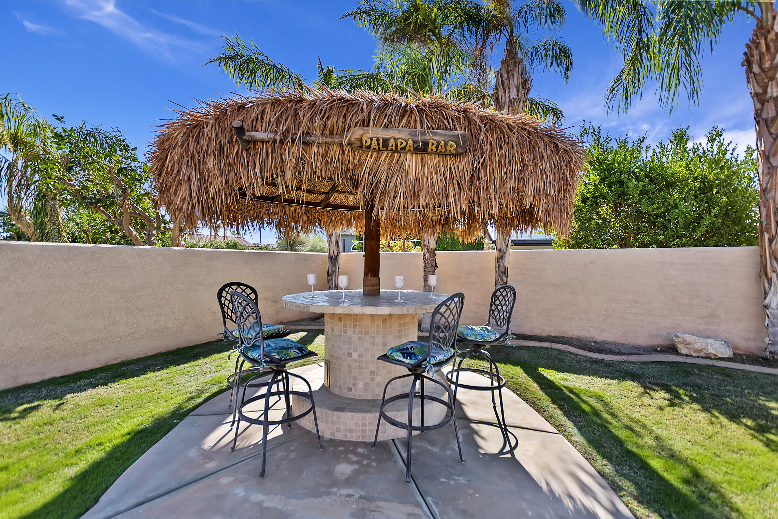68945 Minerva Road Cathedral City, CA 92234 - Photo 3 of 42 a backyard of a house with table and chairs