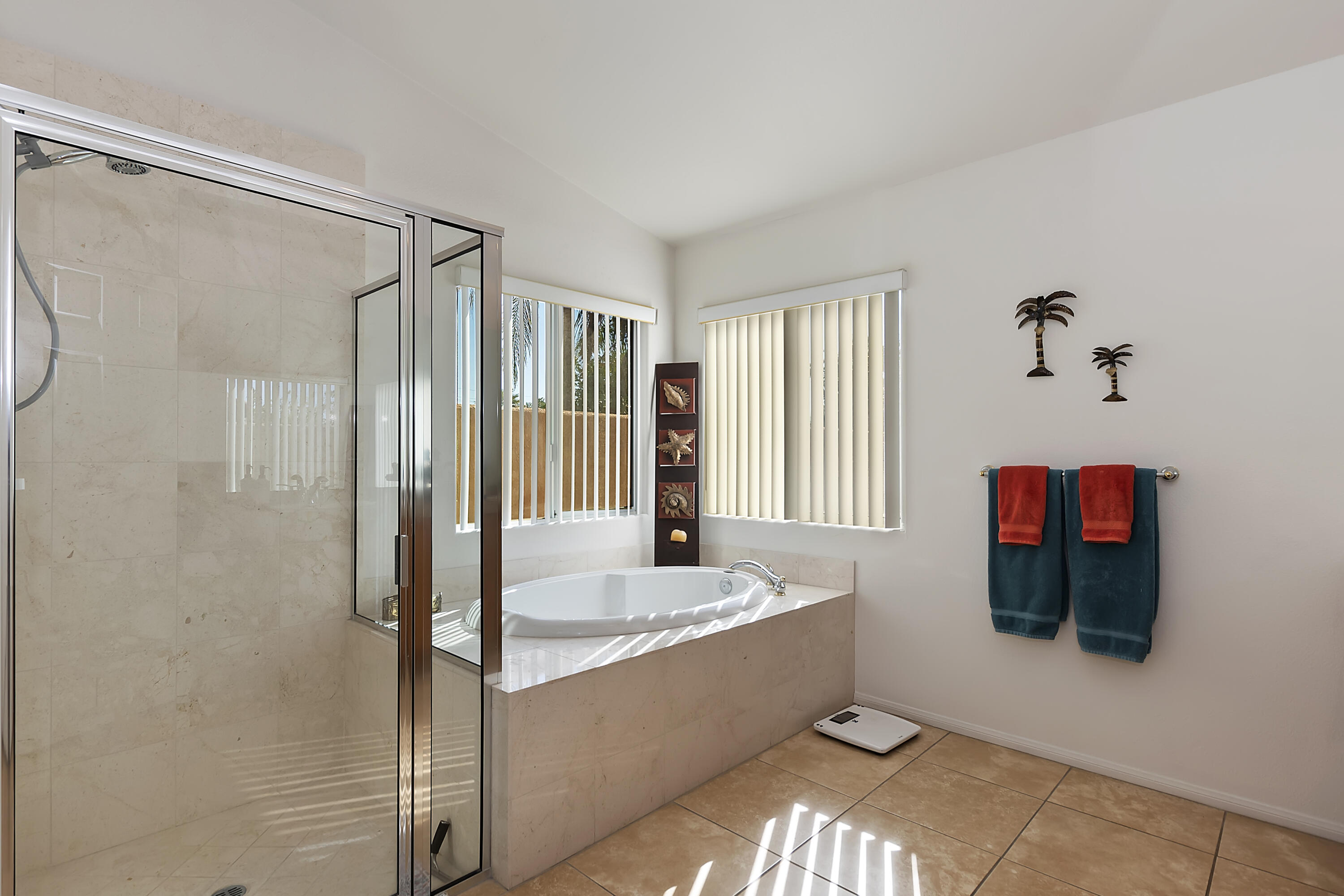 68945 Minerva Road Cathedral City, CA 92234 - Photo 31 of 42 a bathroom with a tub and shower