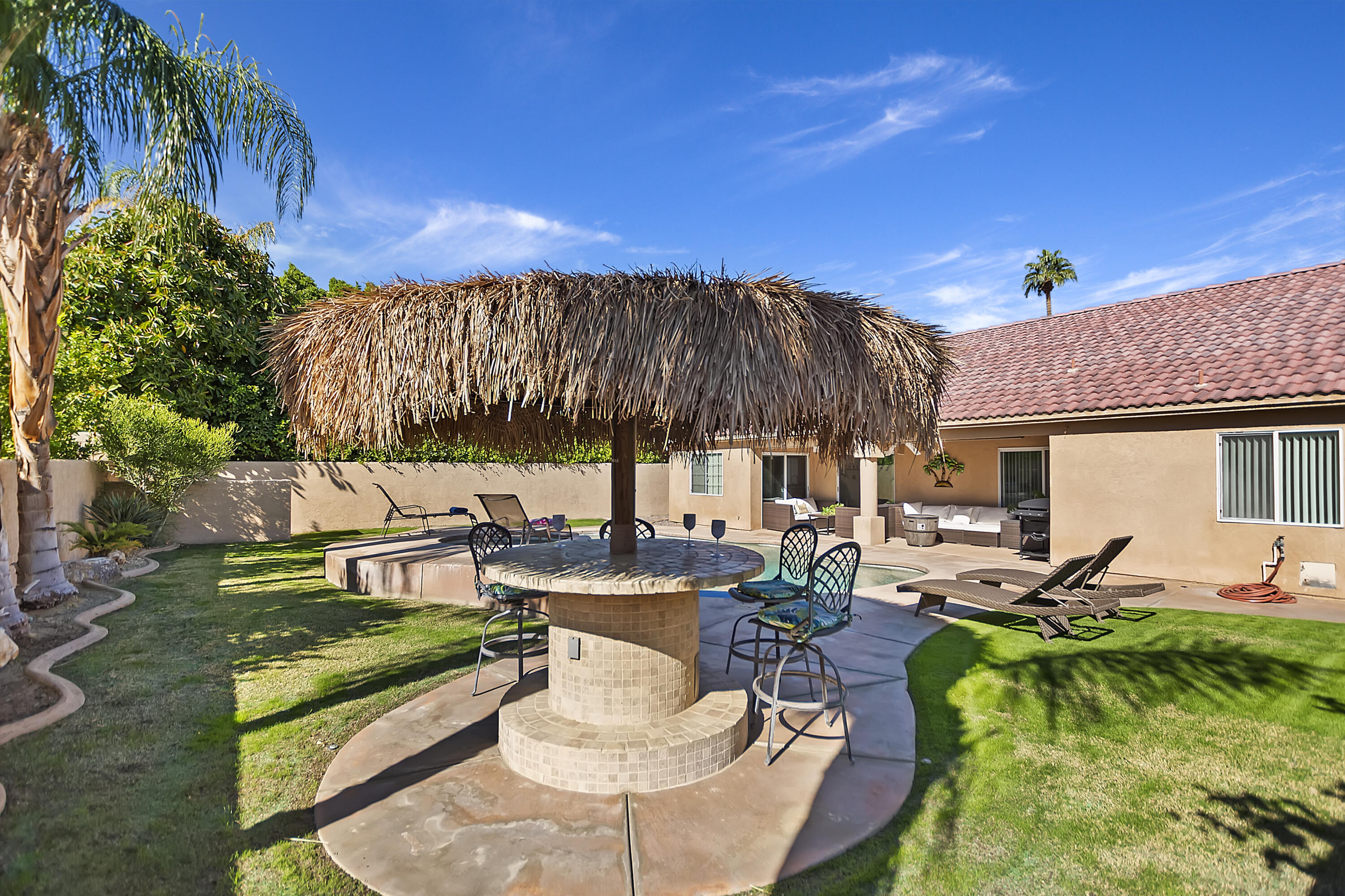 68945 Minerva Road Cathedral City, CA 92234 - Photo 34 of 42 a view of a backyard with sitting area