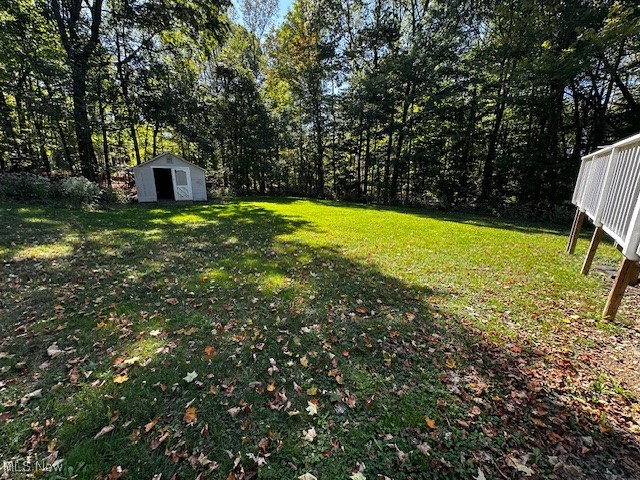 12470 Caves Road Chesterland, OH 44026 - Photo 3 of 24 View of green lawn with a storage shed