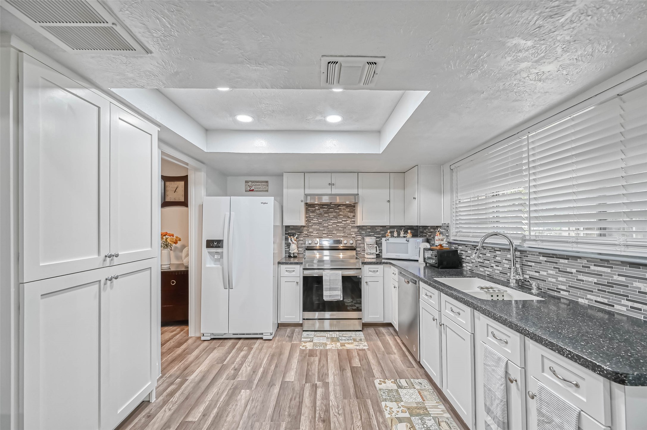 11618 Corona Lane Houston, TX 77072 - Photo 13 of 50 a kitchen with stainless steel appliances granite countertop a sink and stove top oven