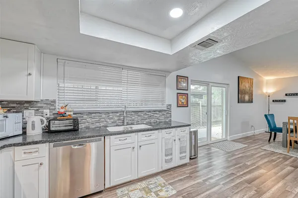 a kitchen with sink and cabinets