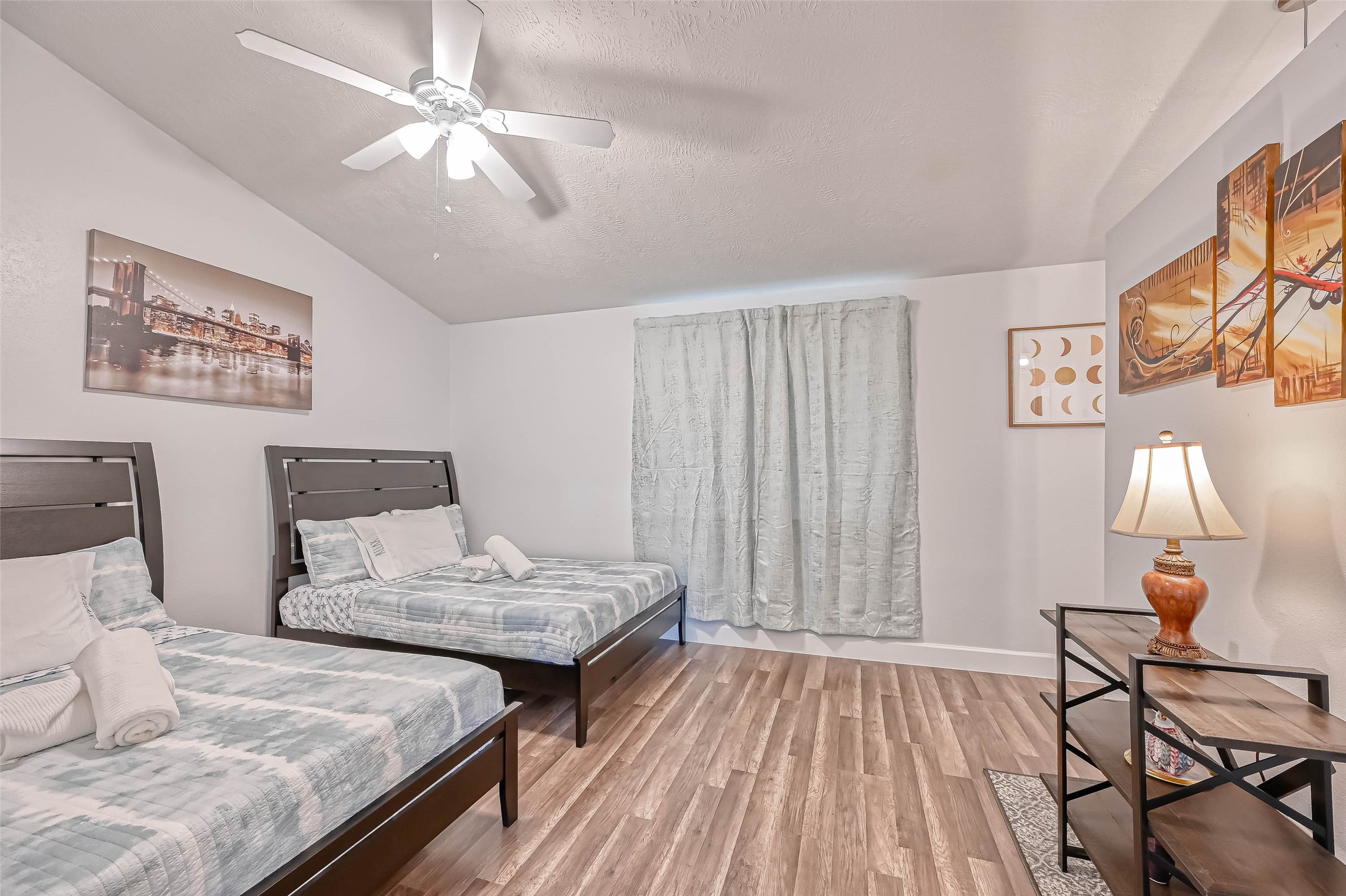 11618 Corona Lane Houston, TX 77072 - Photo 19 of 50 a bedroom with a bed and wooden floor