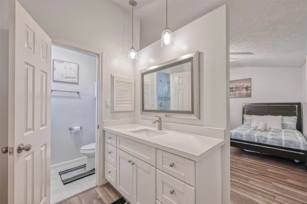 a spacious bathroom with a double vanity sink and a mirror