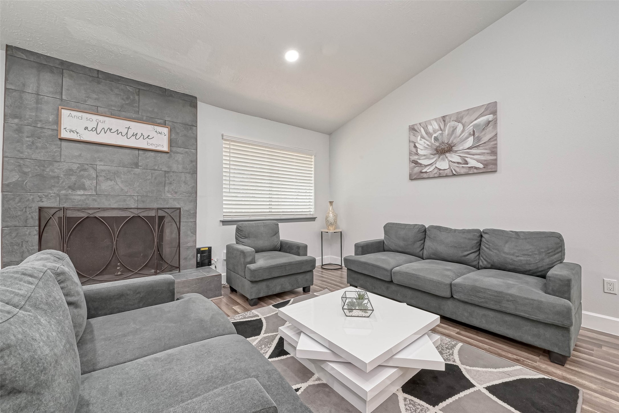 11618 Corona Lane Houston, TX 77072 - Photo 36 of 50 a living room with furniture a rug and a fireplace