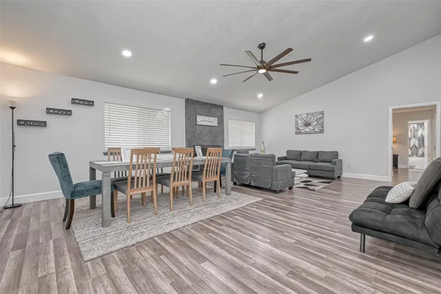 a view of a dining room with furniture window and wooden floor