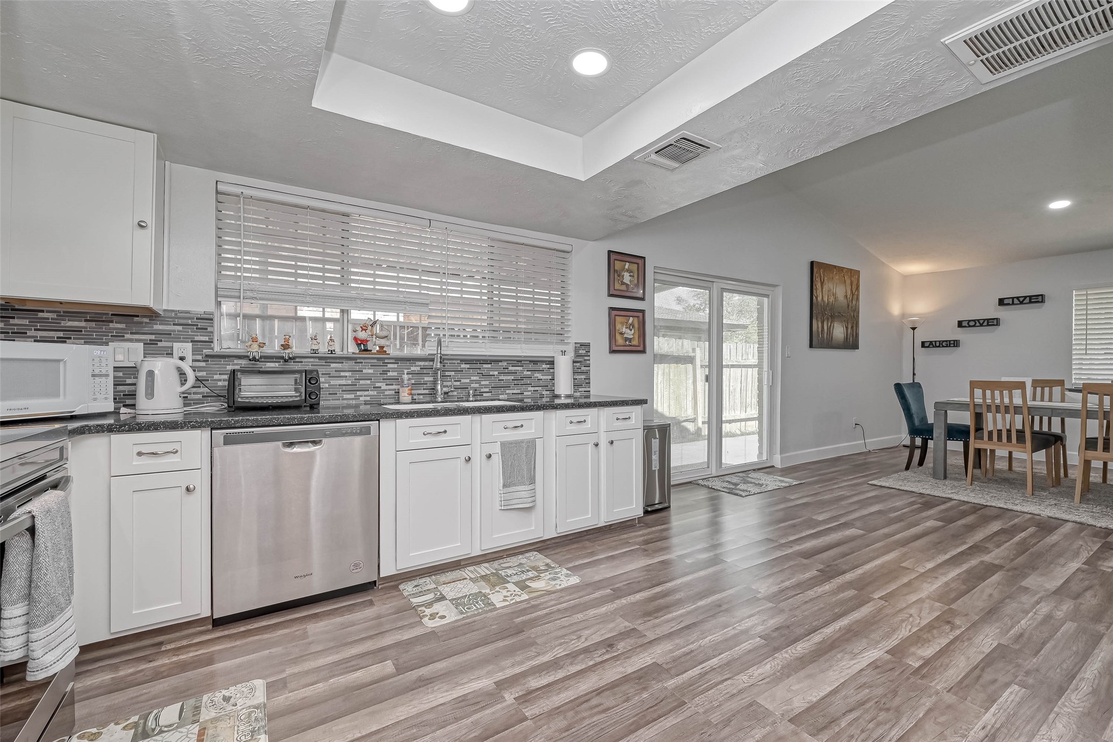 11618 Corona Lane Houston, TX 77072 - Photo 46 of 50 a kitchen with stainless steel appliances granite countertop a stove and cabinets