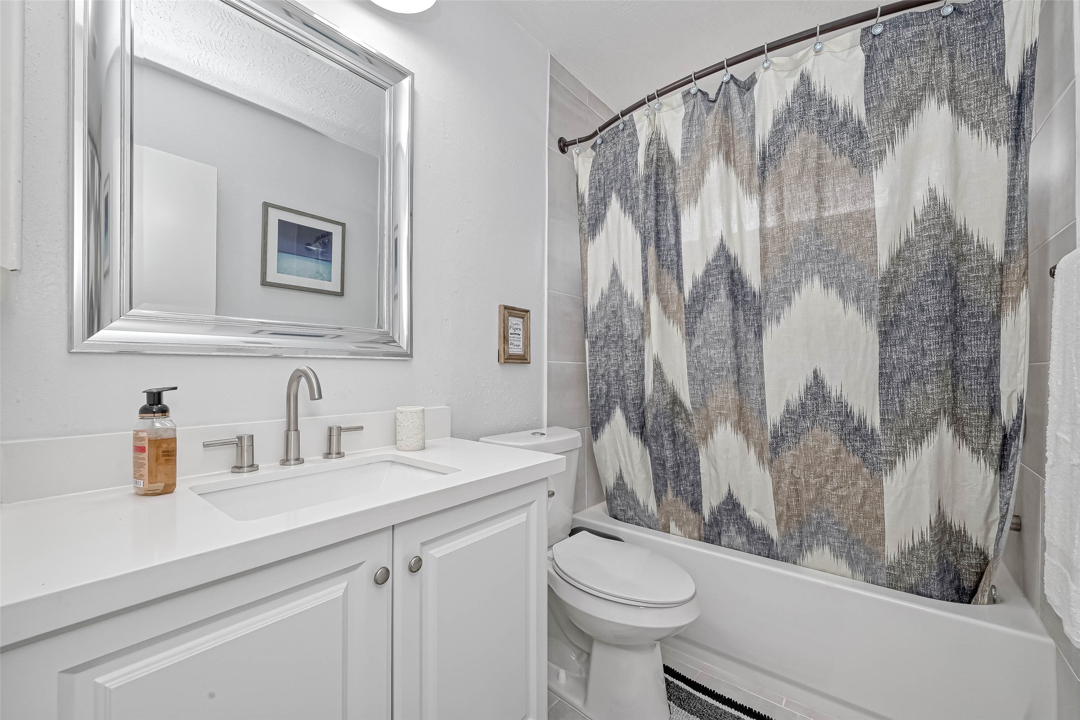 11618 Corona Lane Houston, TX 77072 - Photo 50 of 50 a bathroom with a sink a toilet and a shower curtain