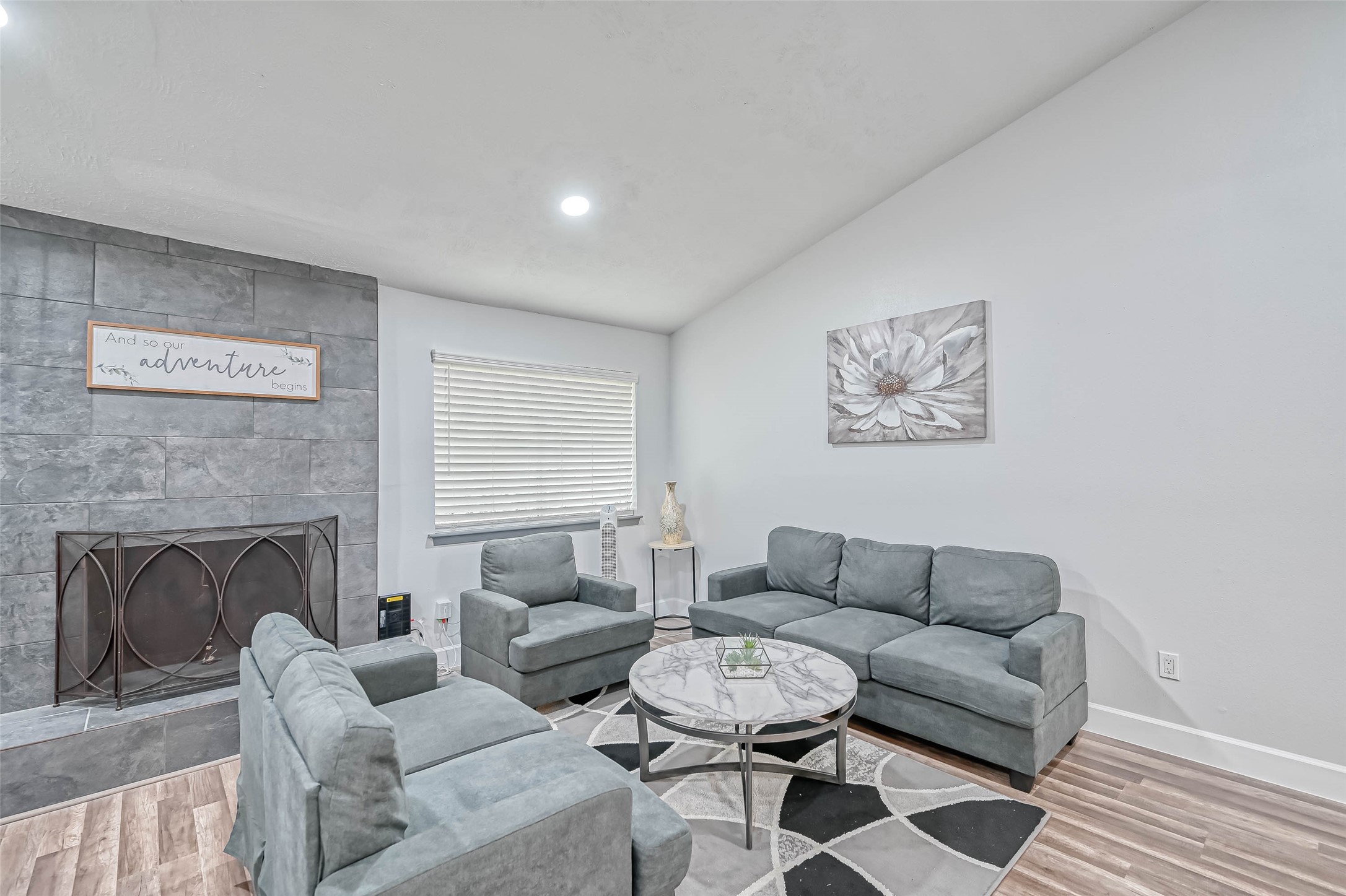 11618 Corona Lane Houston, TX 77072 - Photo 6 of 50 a living room with furniture a rug and a fireplace