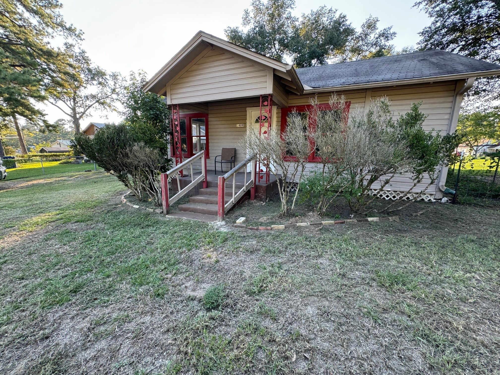 1809 Old Israel Road Livingston, TX 77351 - Photo 2 of 15 a view of a small house with a patio and a yard
