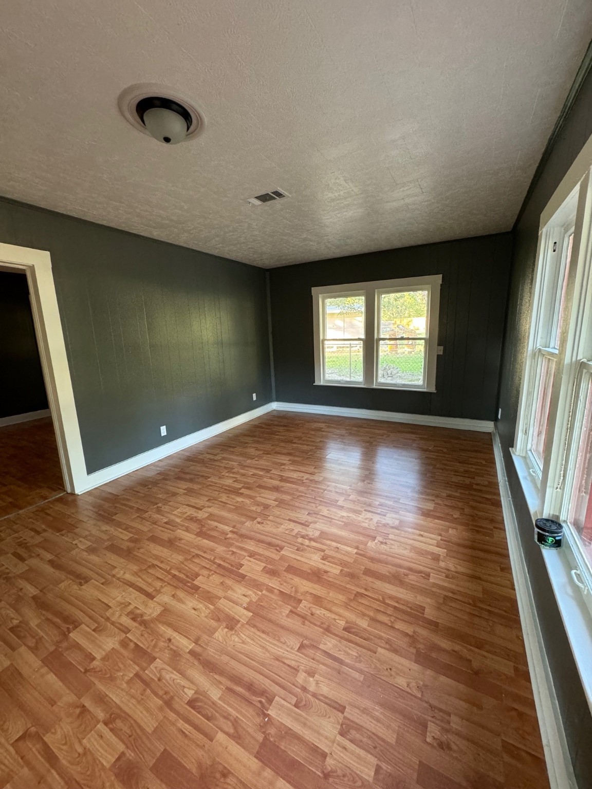 1809 Old Israel Road Livingston, TX 77351 - Photo 3 of 15 a view of empty room with wooden floor and fan